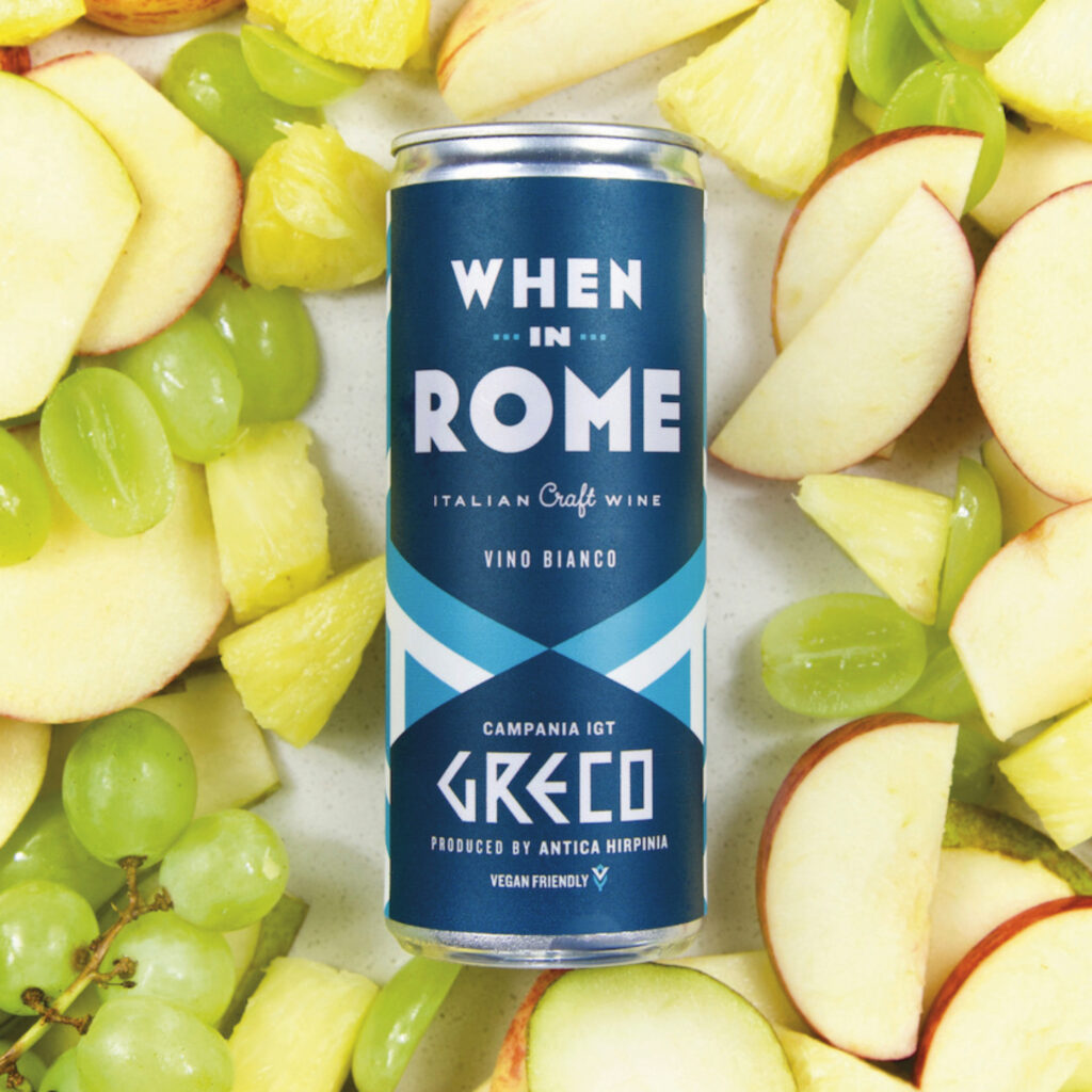 Canned wine When in Rome Wine gifting set on a table with sliced apples by Skye High Group Amazon Marketing Agency